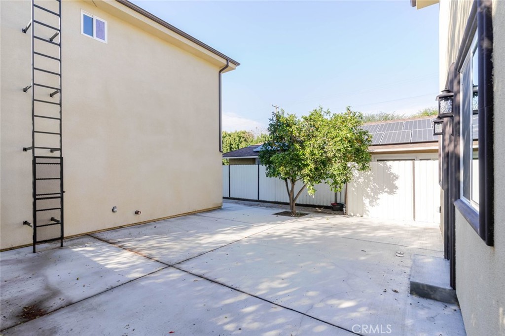 17426 Roscoe Boulevard Northridge, CA 91325 - Photo 27 of 28 a view of a house with backyard and plants