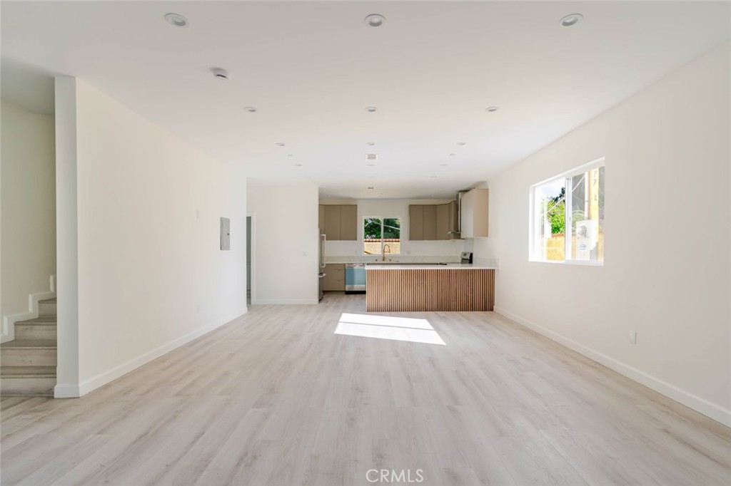 17426 Roscoe Boulevard Northridge, CA 91325 - Photo 5 of 28 a large white bed in a white room