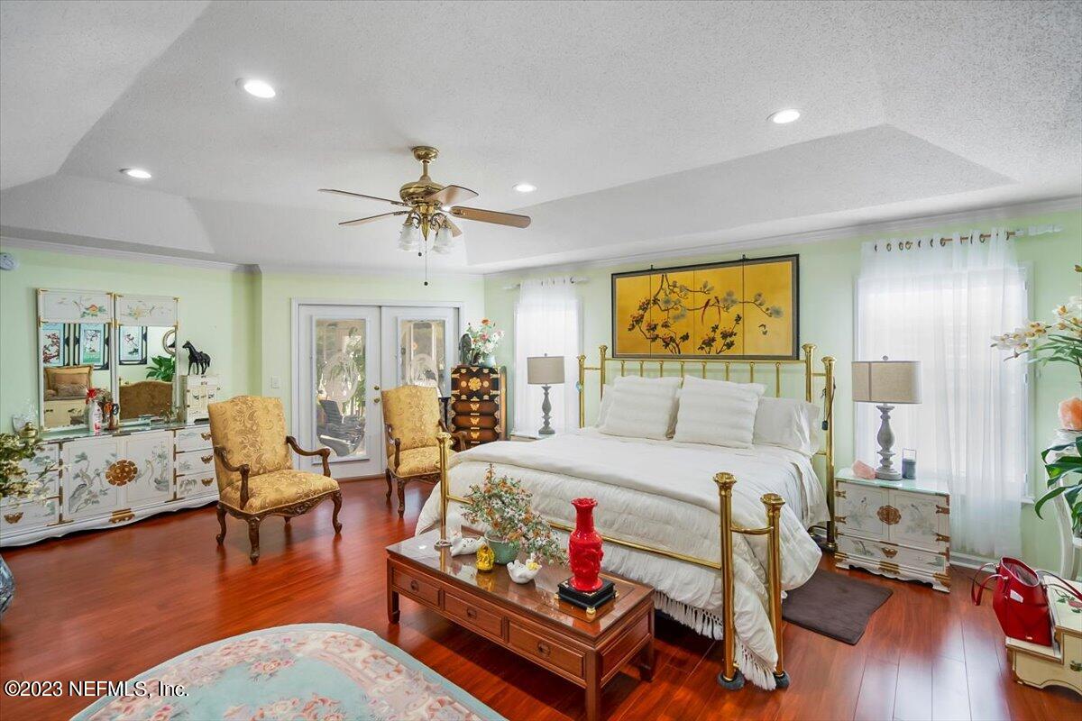 1233 Cactus Cut Road Middleburg, FL 32068 - Photo 16 of 46 a bedroom with furniture and a large window