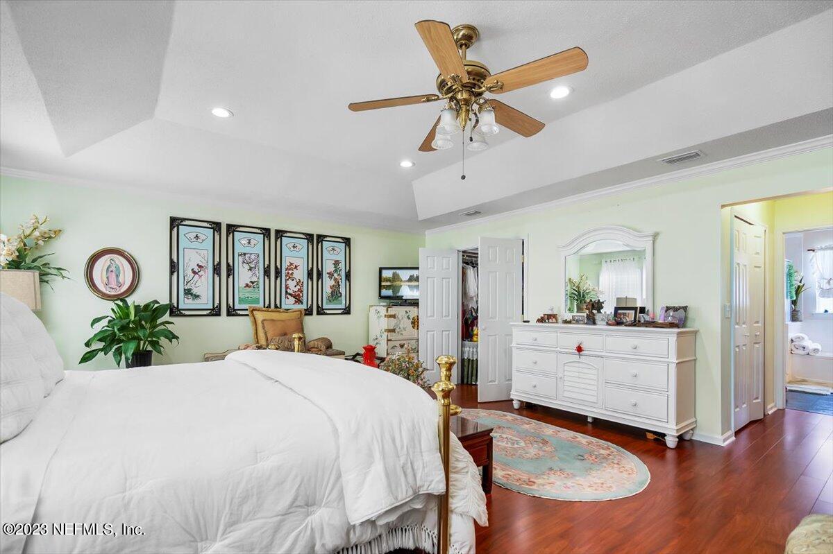 1233 Cactus Cut Road Middleburg, FL 32068 - Photo 19 of 46 a bed room with a bed mirror and a window