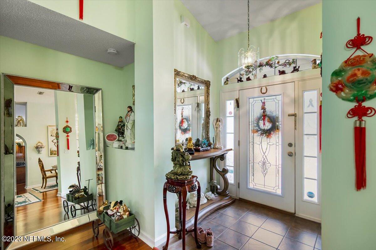 1233 Cactus Cut Road Middleburg, FL 32068 - Photo 24 of 46 a view of hall way with mirror and furniture