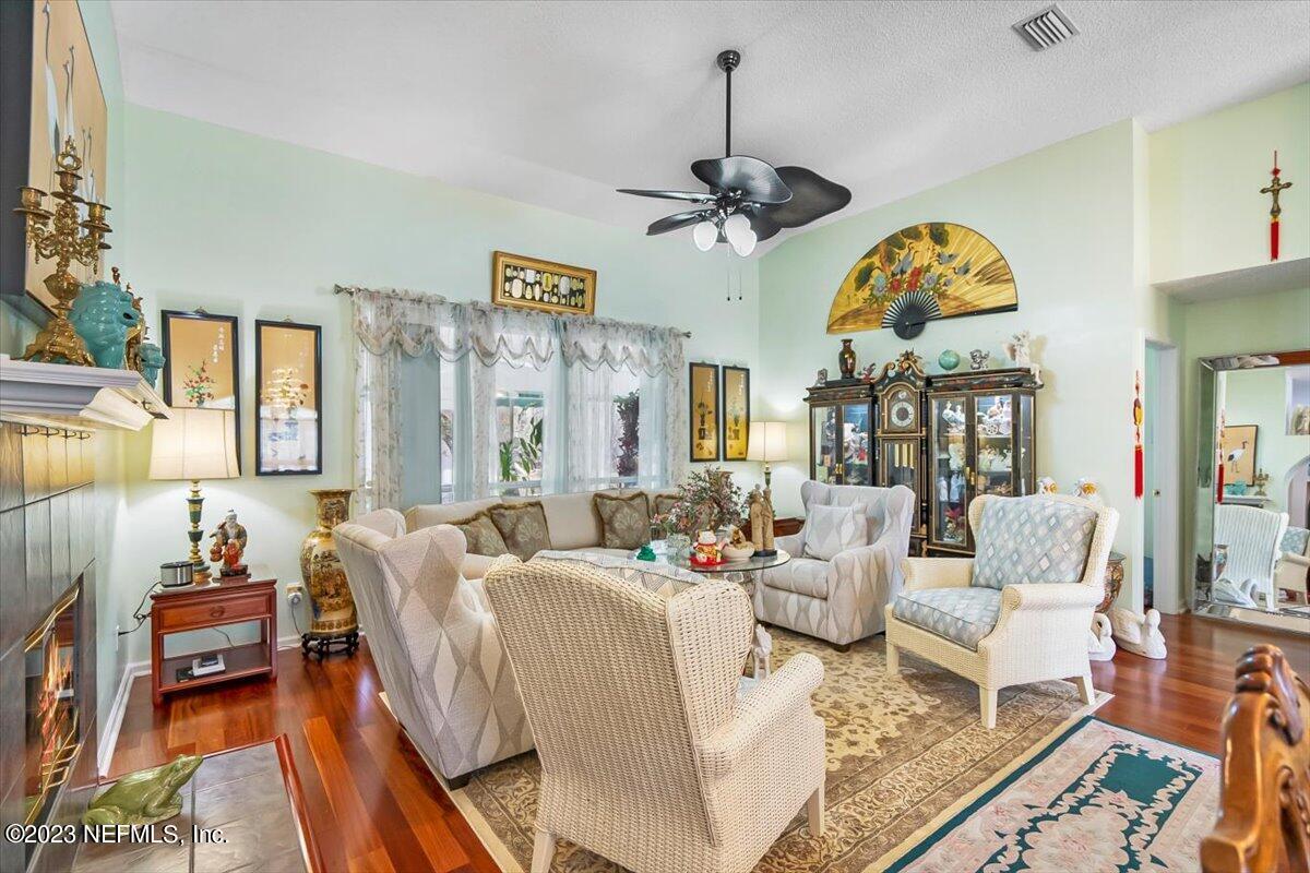 1233 Cactus Cut Road Middleburg, FL 32068 - Photo 26 of 46 a living room with patio bathtub and a chandelier