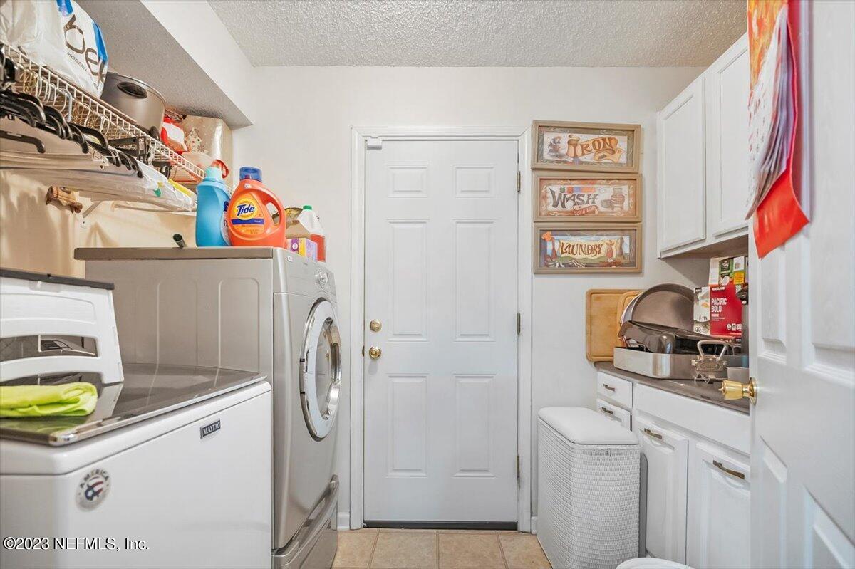 1233 Cactus Cut Road Middleburg, FL 32068 - Photo 27 of 46 a utility room with dryer and washer