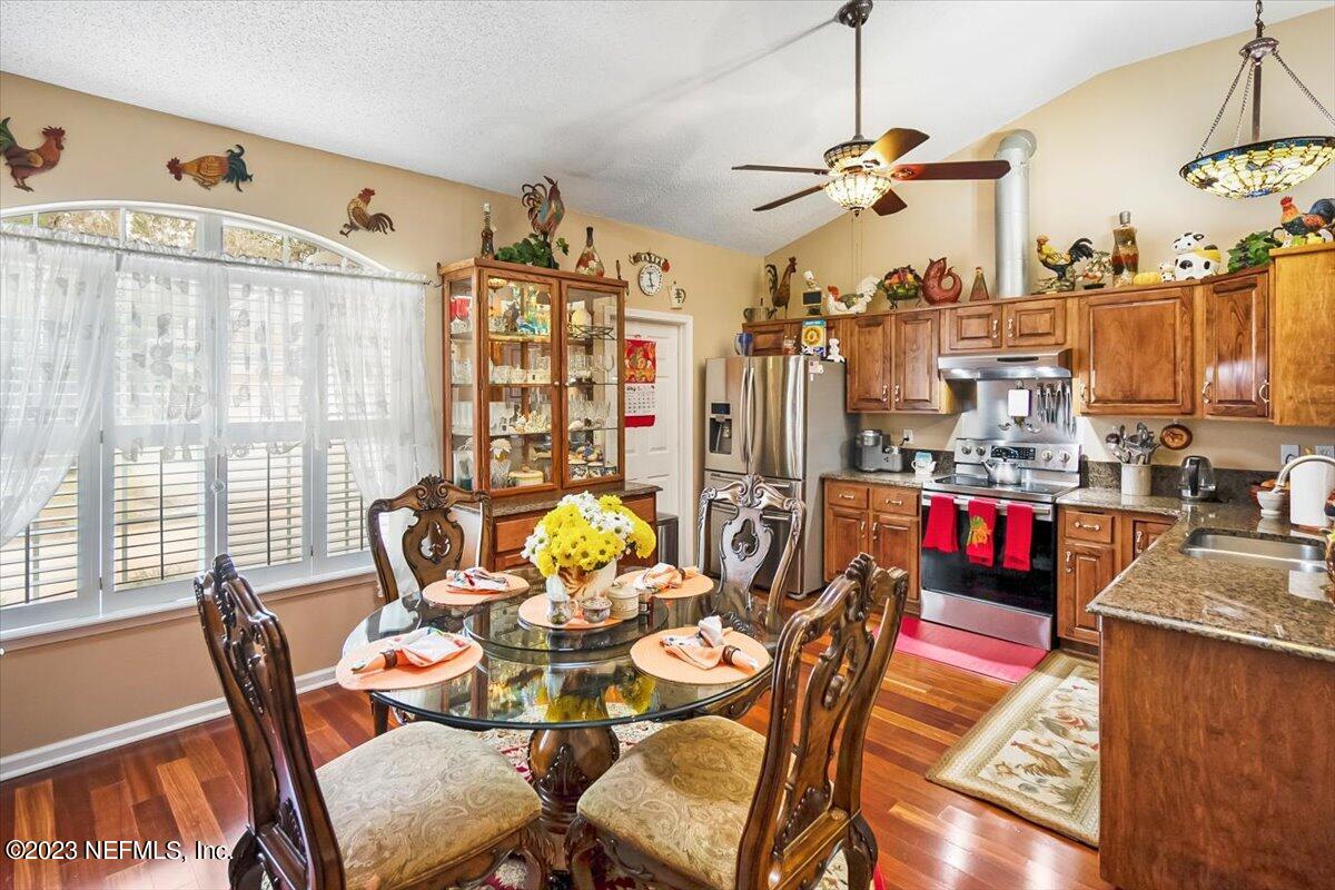 1233 Cactus Cut Road Middleburg, FL 32068 - Photo 30 of 46 a living room filled with furniture and a dining table