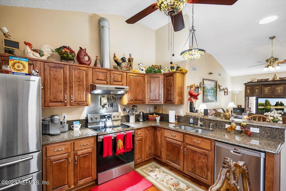 1233 Cactus Cut Road Middleburg, FL 32068 - Photo 31 of 46 a kitchen with sink cabinets and window