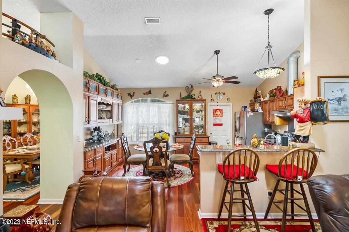 1233 Cactus Cut Road Middleburg, FL 32068 - Photo 32 of 46 a view of a dining room with furniture