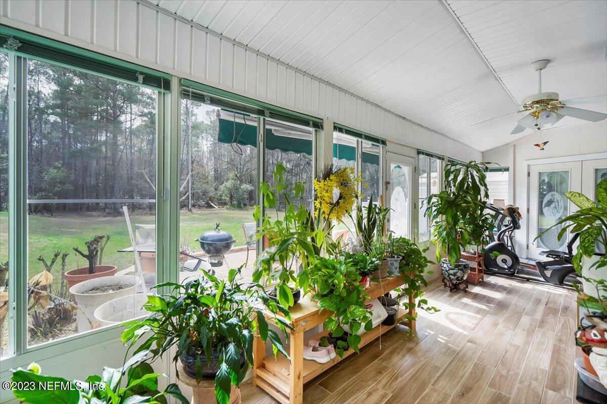 1233 Cactus Cut Road Middleburg, FL 32068 - Photo 41 of 46 a potted plant sitting in front of a window