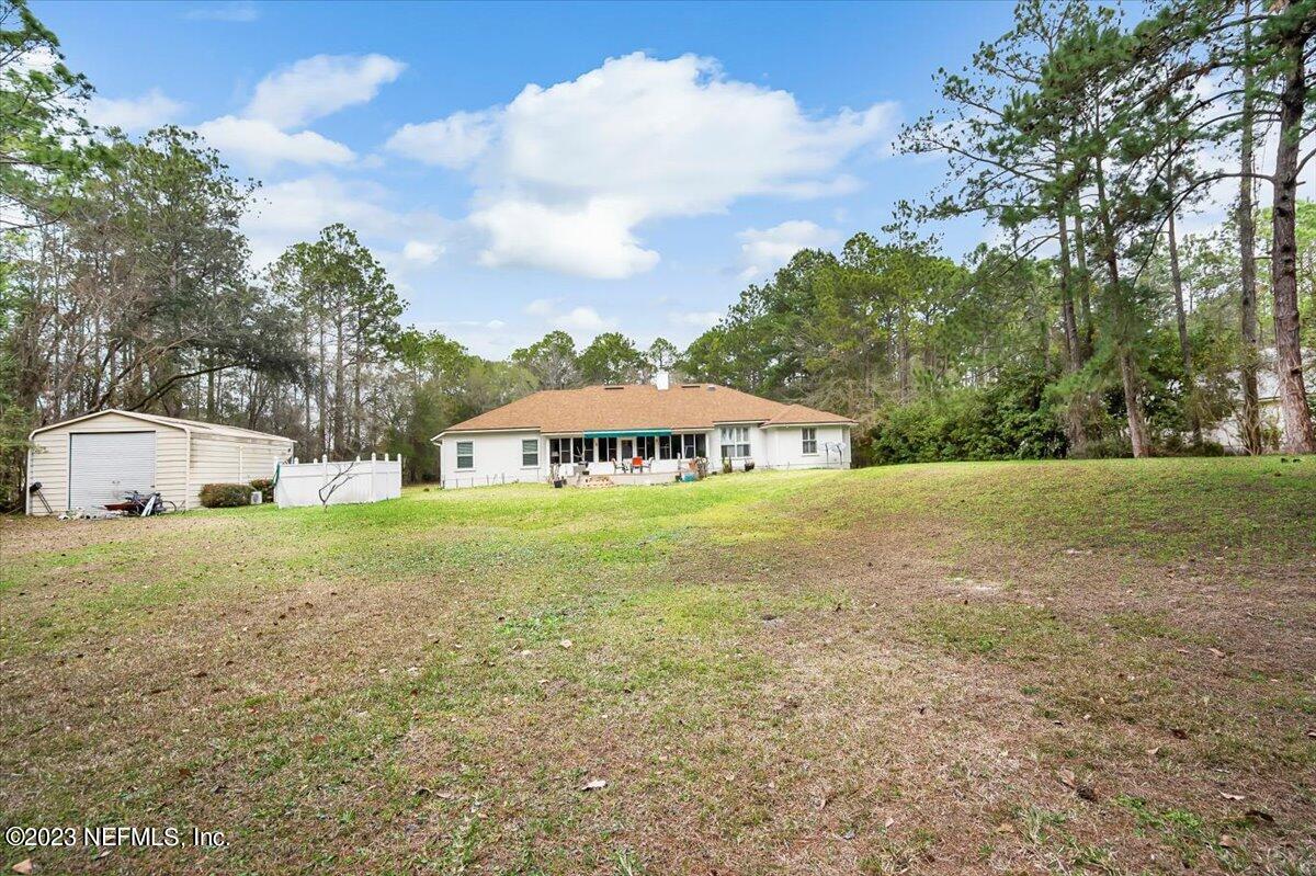 1233 Cactus Cut Road Middleburg, FL 32068 - Photo 44 of 46 a view of a house with a yard