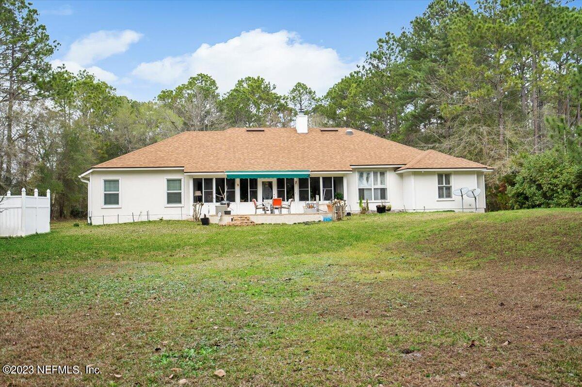 1233 Cactus Cut Road Middleburg, FL 32068 - Photo 45 of 46 a front view of a house with a garden