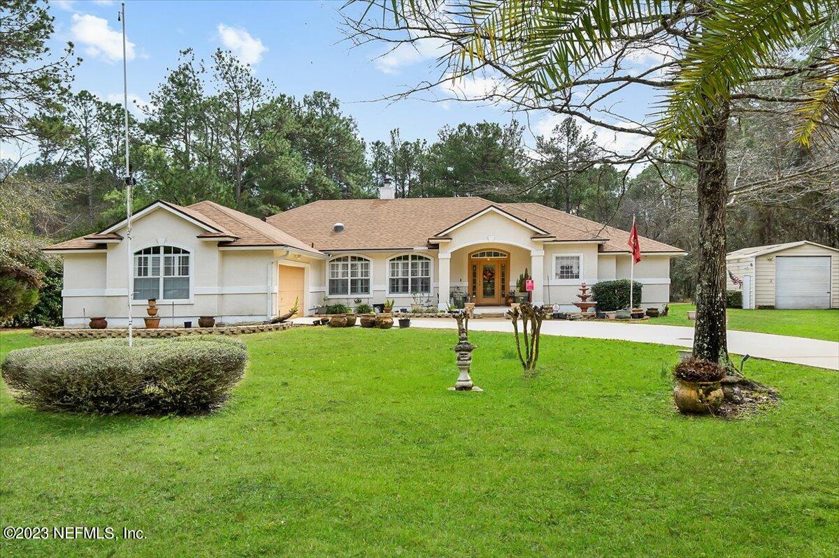 1233 Cactus Cut Road Middleburg, FL 32068 - Photo 46 of 46 a front view of house with yard and green space