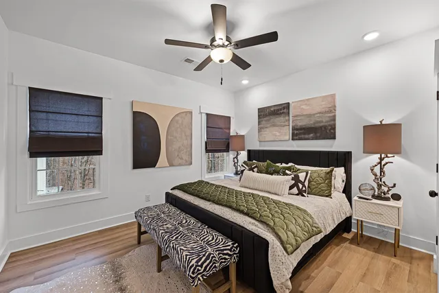 a bedroom with a large bed and a window