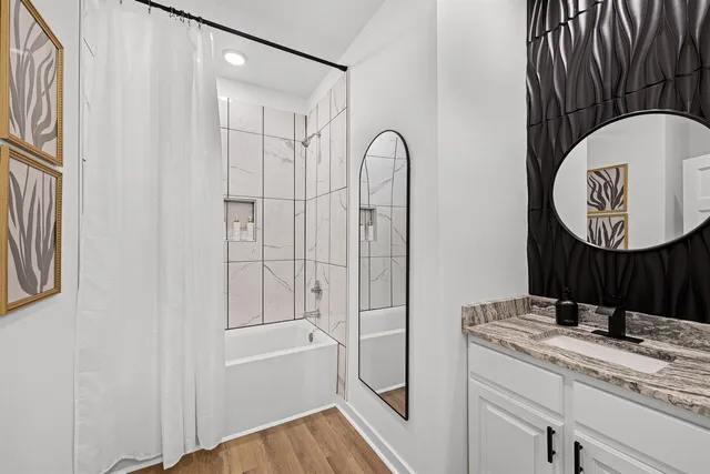 a bathroom with a sink and a mirror