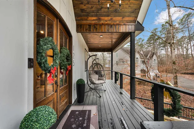 a view of a balcony with furniture