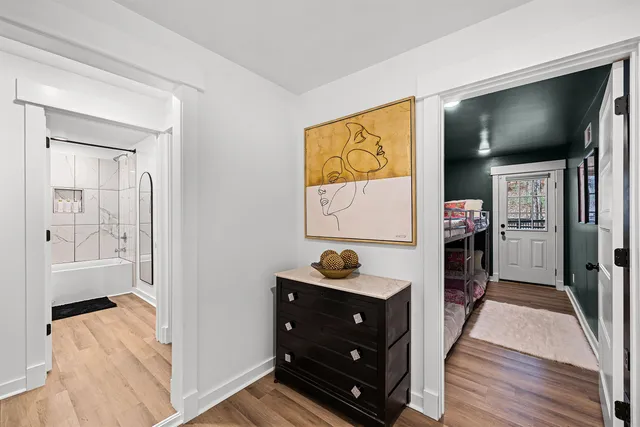 a view of room with window and wooden floor