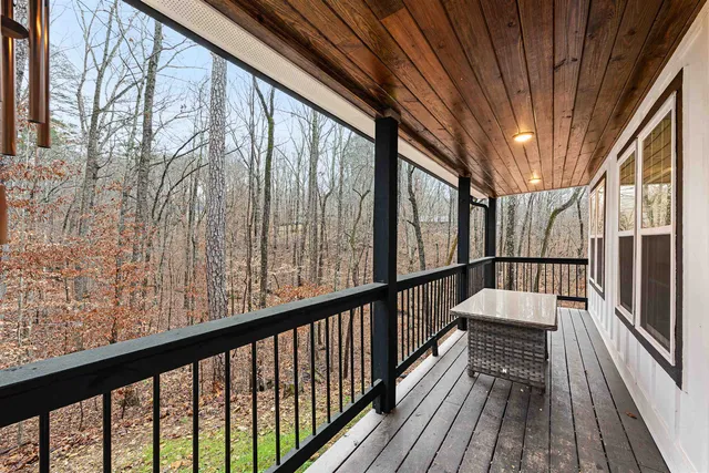 a view of balcony with wooden floor