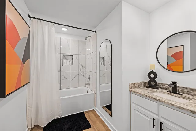 a view of a patio with a table and chairs