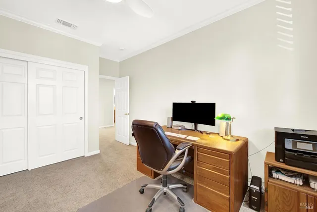 a view of backyard with seating space and trees