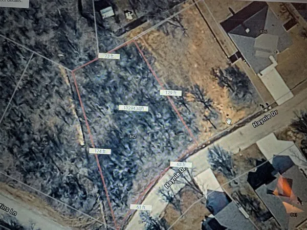 a aerial view of a house with a yard