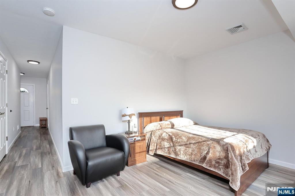 209 Union Street, Unit 4 Lodi, NJ 07644 - Photo 11 of 41 a bedroom with a bed and a couch