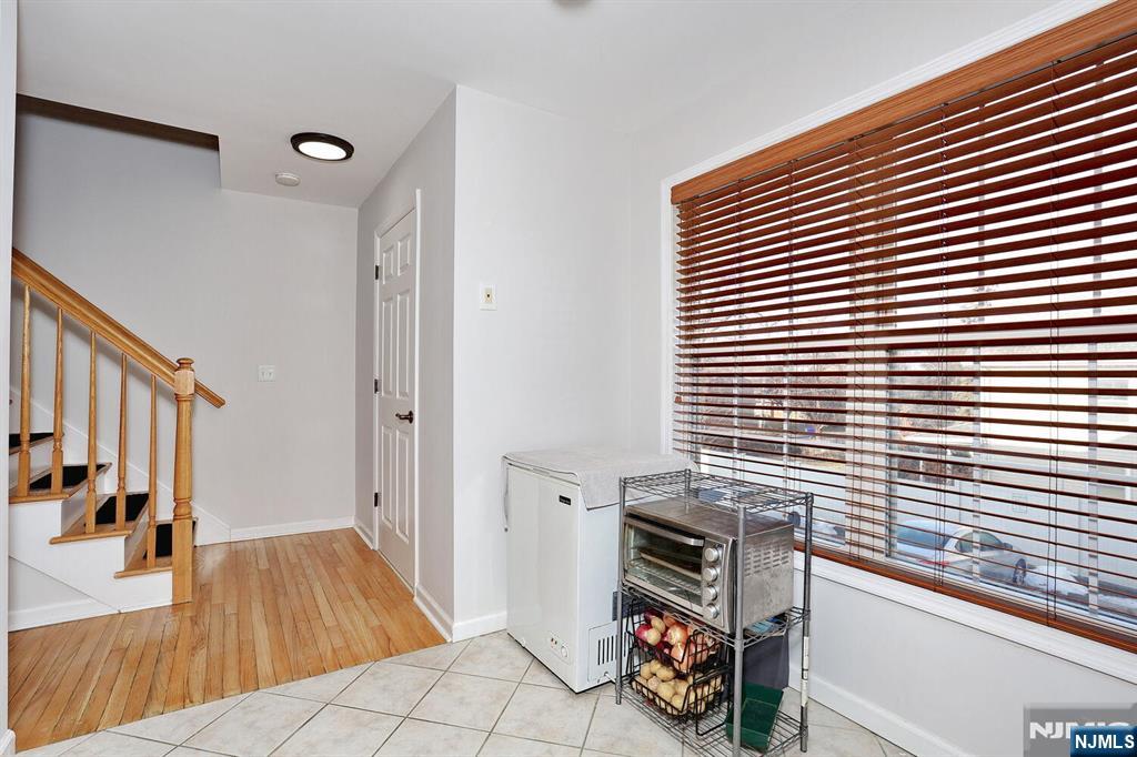 209 Union Street, Unit 4 Lodi, NJ 07644 - Photo 23 of 41 a view of a livingroom with furniture and wooden floor