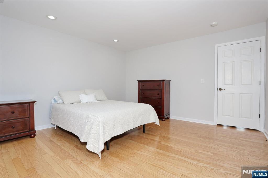 209 Union Street, Unit 4 Lodi, NJ 07644 - Photo 26 of 41 a bedroom with a bed and a dresser