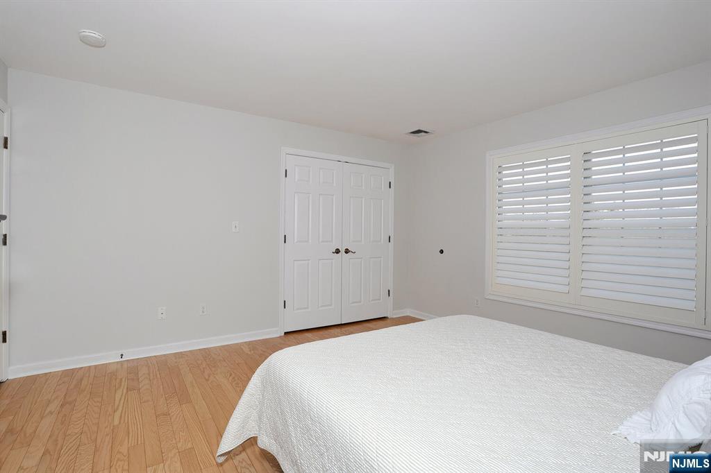 209 Union Street, Unit 4 Lodi, NJ 07644 - Photo 27 of 41 a bedroom with a bed and a window