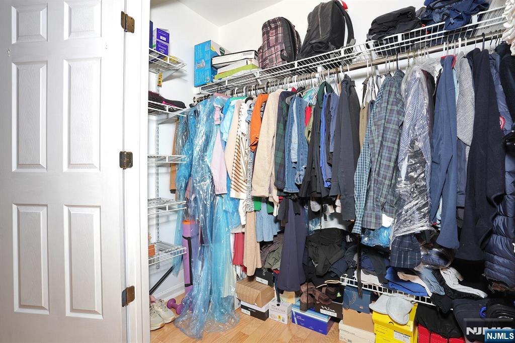 209 Union Street, Unit 4 Lodi, NJ 07644 - Photo 29 of 41 a view of walk in closet with clothes and shoes