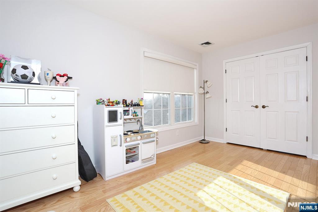 209 Union Street, Unit 4 Lodi, NJ 07644 - Photo 33 of 41 a view of a bedroom with cabinet cabinet and a bed