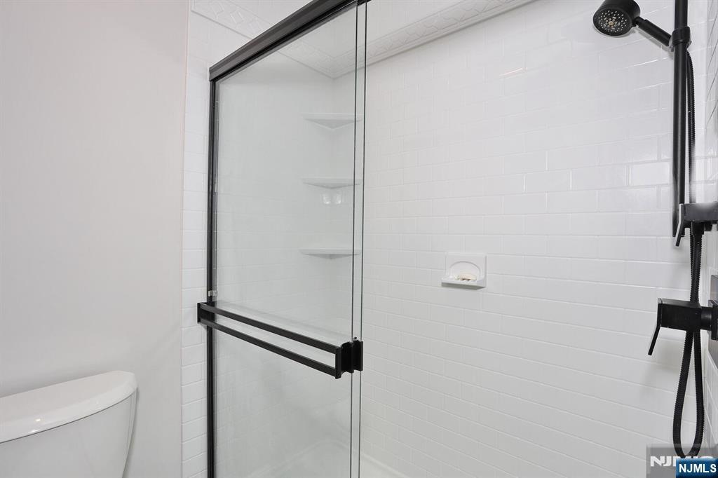 209 Union Street, Unit 4 Lodi, NJ 07644 - Photo 36 of 41 a bathroom with a shower