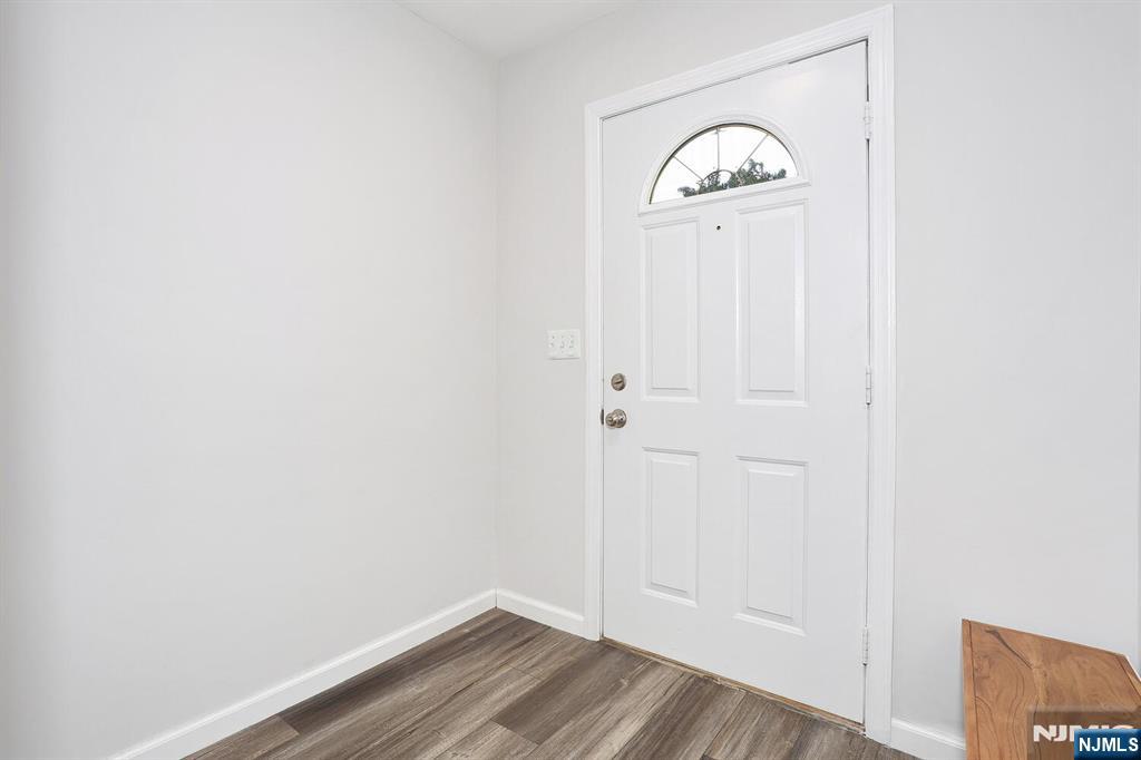 209 Union Street, Unit 4 Lodi, NJ 07644 - Photo 6 of 41 a view of a closet with wooden floor
