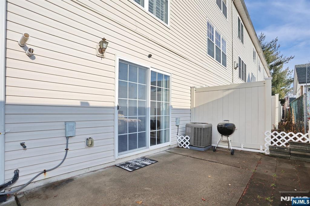 209 Union Street, Unit 4 Lodi, NJ 07644 - Photo 8 of 41 a view of a house with a yard