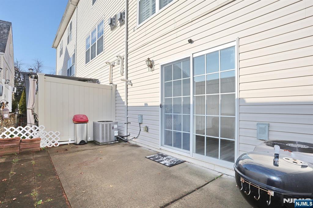 209 Union Street, Unit 4 Lodi, NJ 07644 - Photo 9 of 41 a bathroom with a sink and a mirror