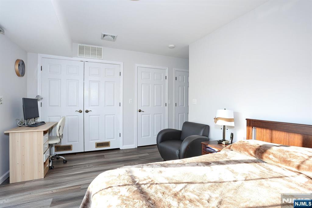 209 Union Street, Unit 4 Lodi, NJ 07644 - Photo 10 of 41 a bedroom with a bed and a television