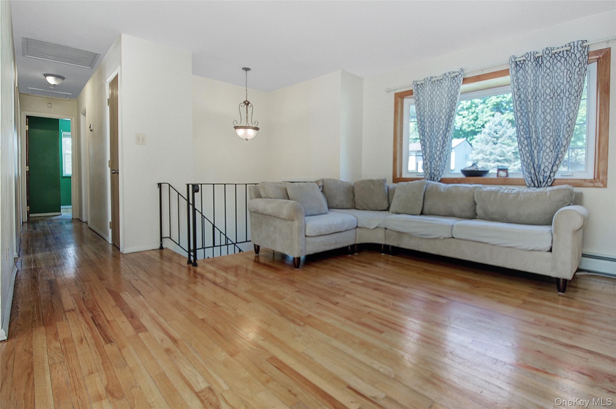 554 High Street Monroe, NY 10950 - Photo 10 of 29 a living room with furniture and a large window