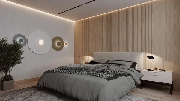 a bed room with a bed and a painting on the wall
