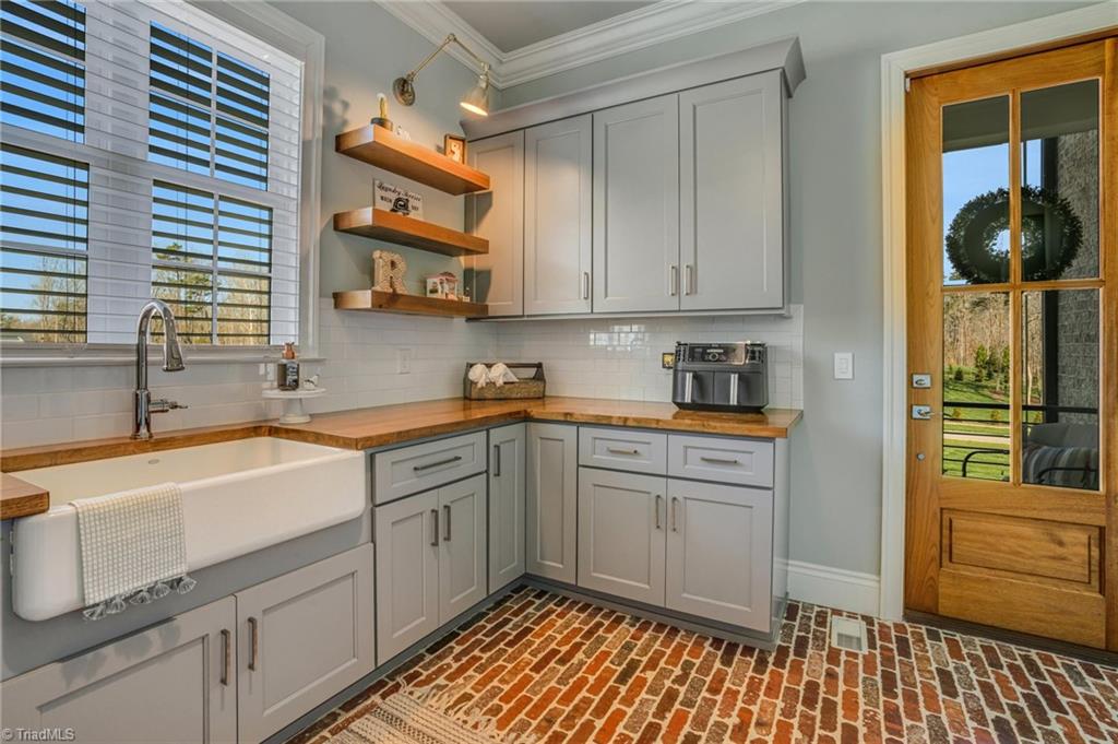6866 Wittington Court Oak Ridge, NC 27310 - Photo 14 of 46 Laundry room for all needs on main level
