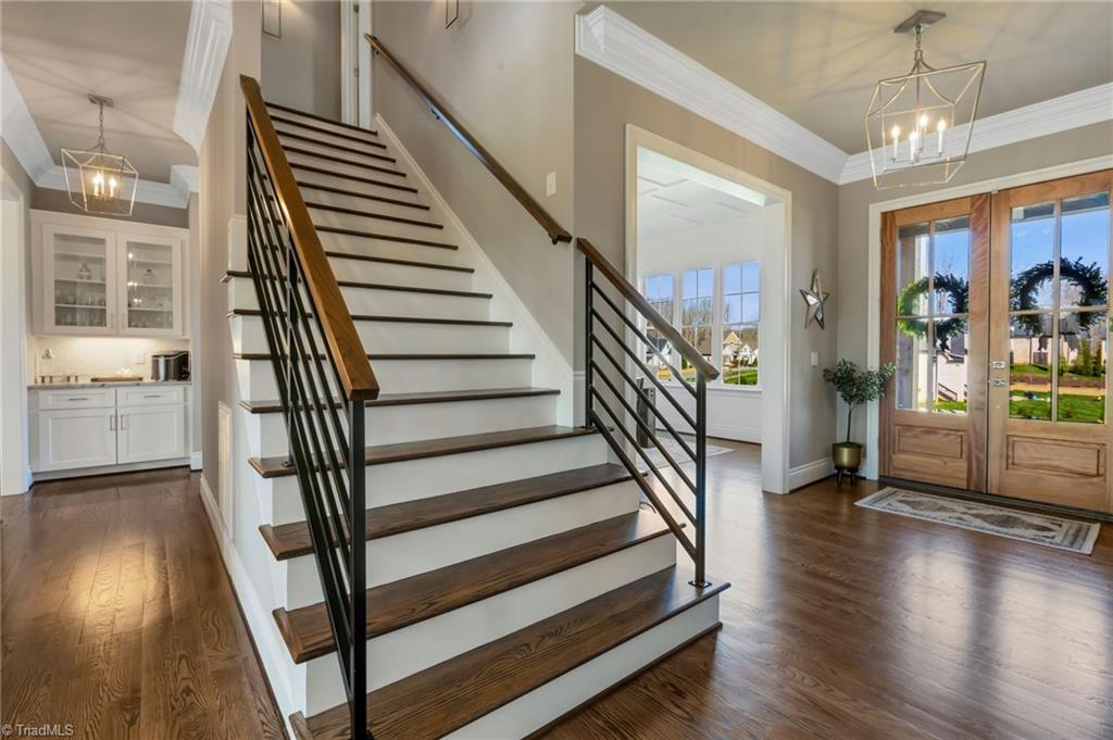 6866 Wittington Court Oak Ridge, NC 27310 - Photo 24 of 46 Open stairs with open rails