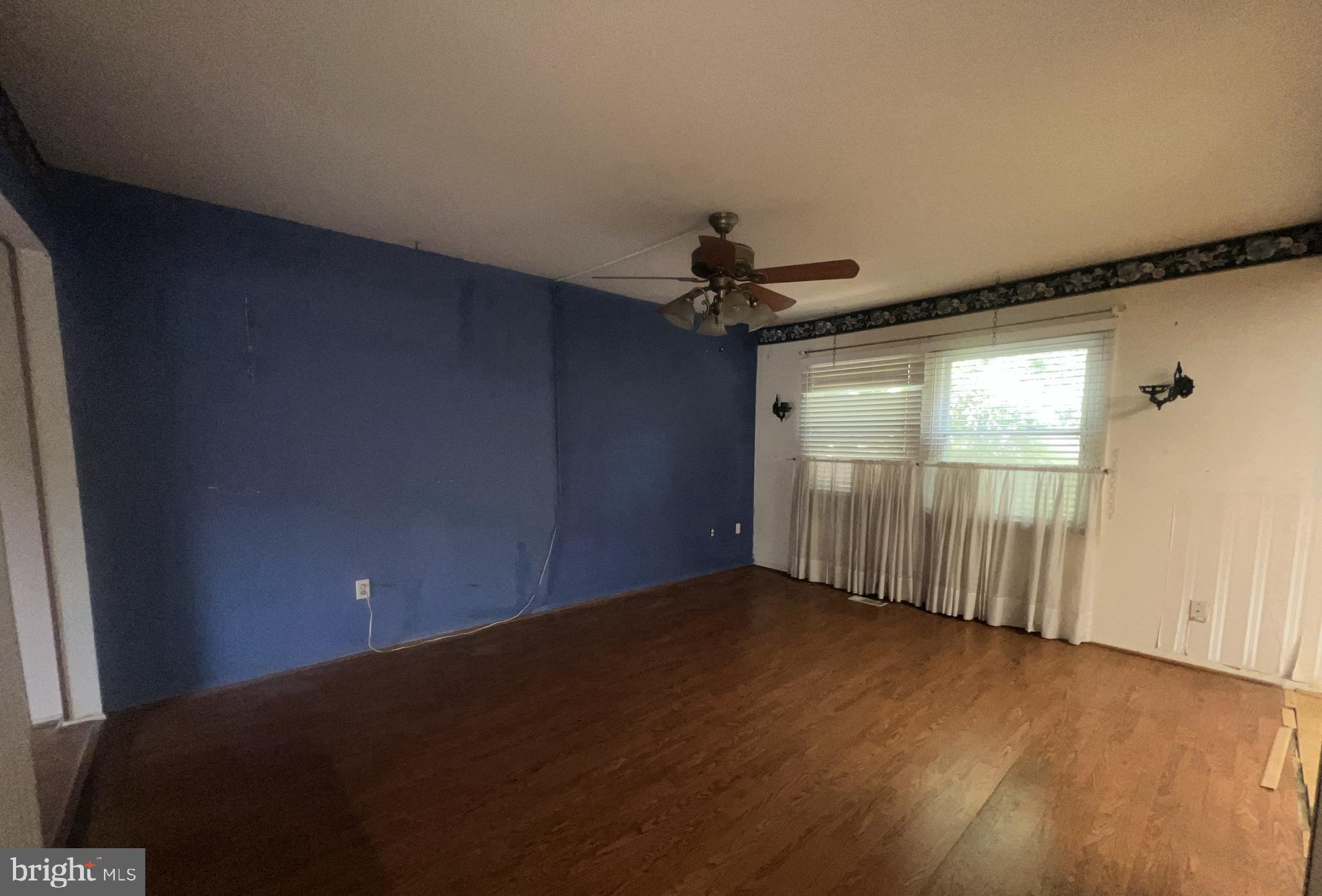 1723 Gabriel Court Crofton, MD 21114 - Photo 11 of 46 a view of a livingroom with wooden floor and window