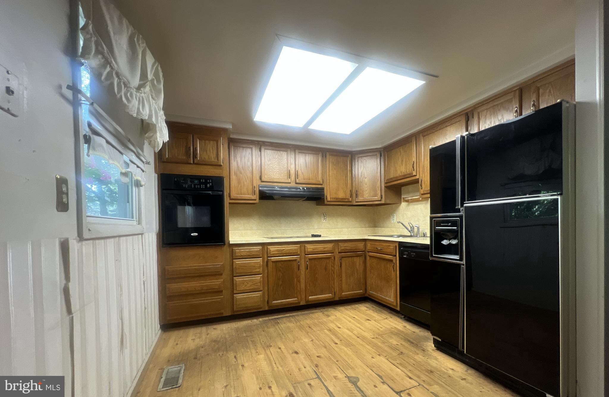 1723 Gabriel Court Crofton, MD 21114 - Photo 13 of 46 a kitchen with stainless steel appliances granite countertop a refrigerator and a sink
