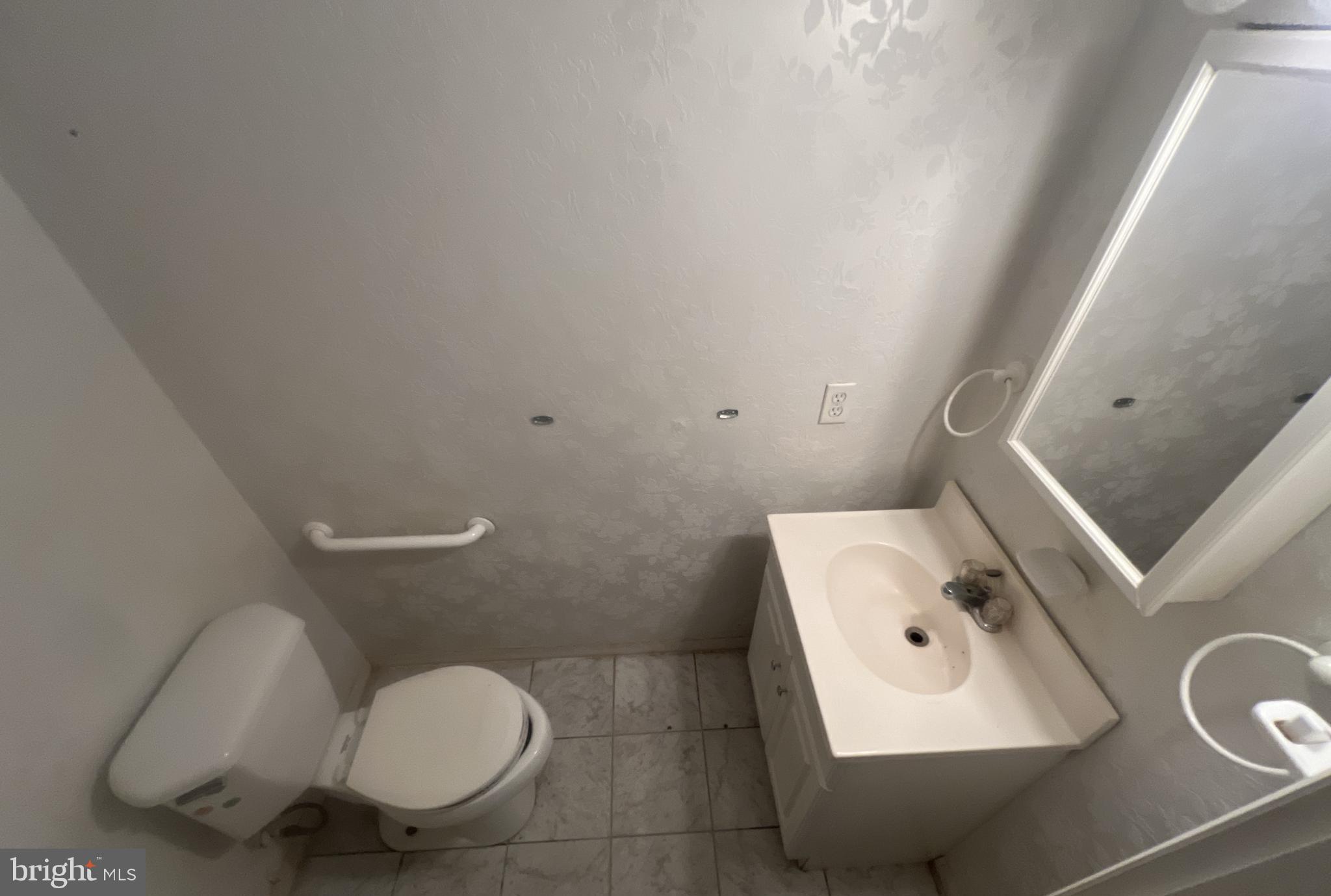1723 Gabriel Court Crofton, MD 21114 - Photo 14 of 46 a bathroom with a toilet sink and mirror