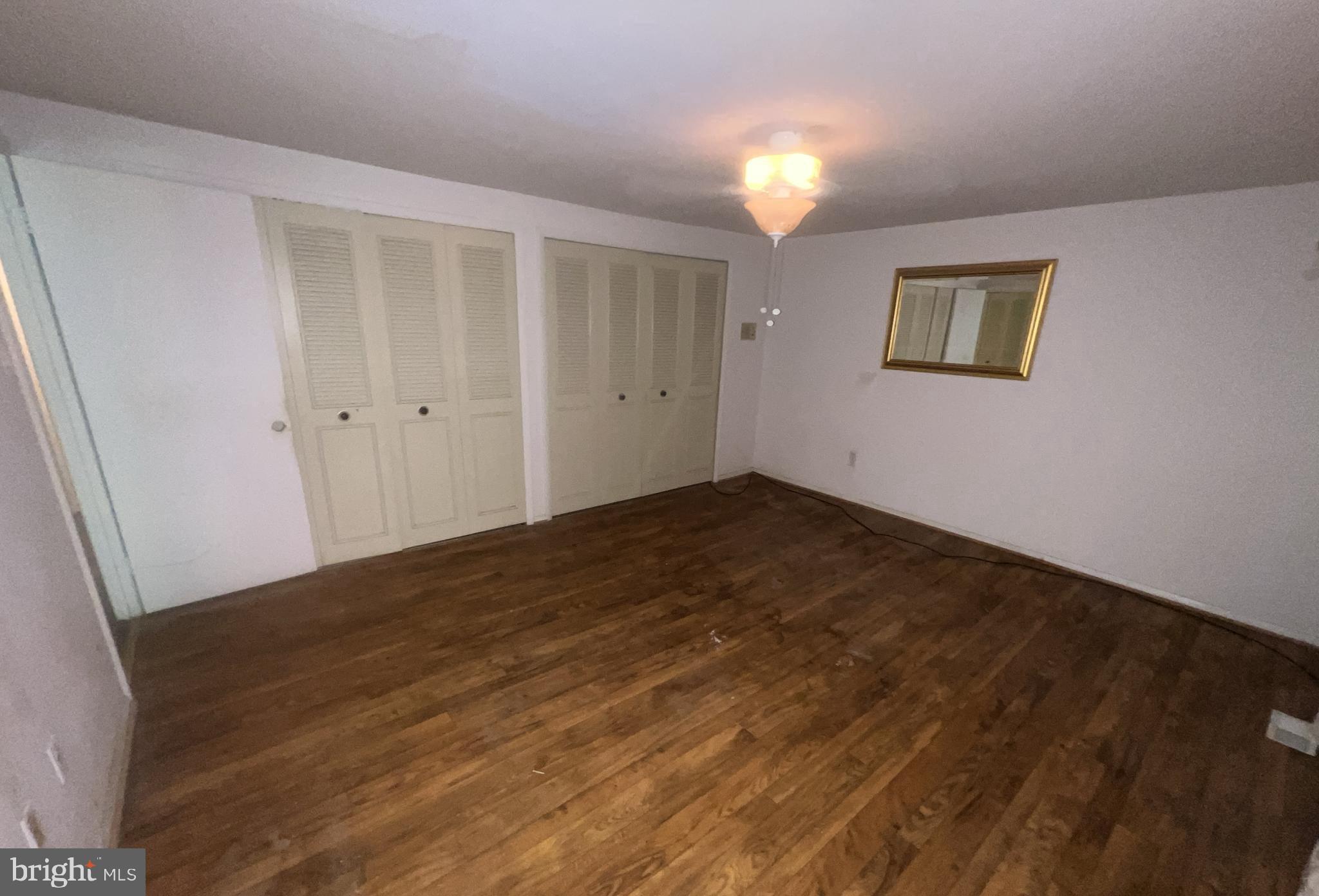 1723 Gabriel Court Crofton, MD 21114 - Photo 16 of 46 a view of a big room with wooden floor and windows