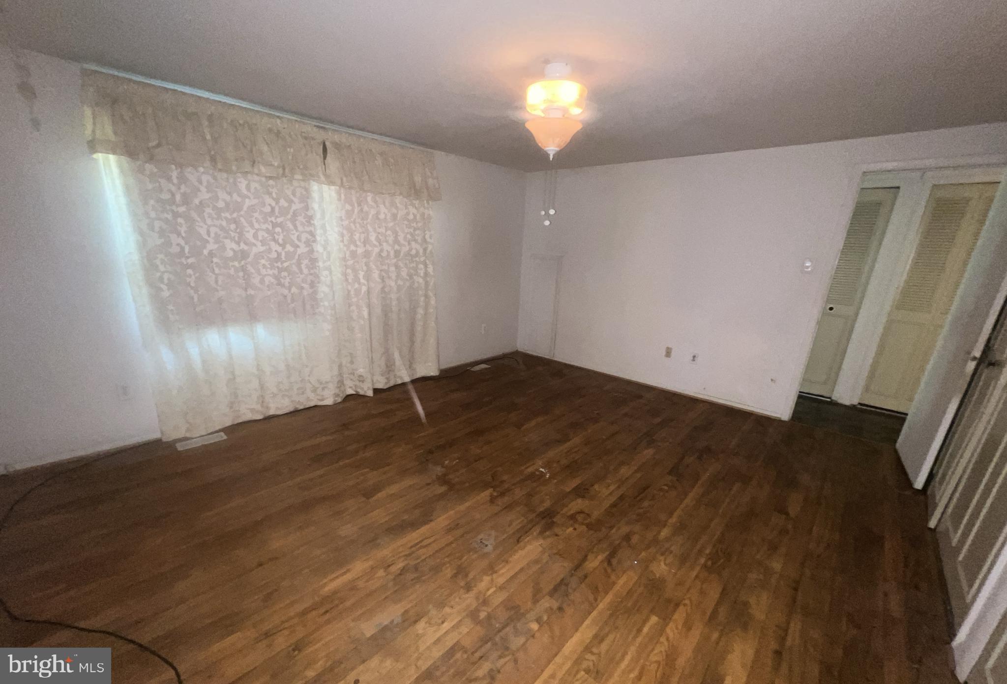1723 Gabriel Court Crofton, MD 21114 - Photo 17 of 46 a view of empty room with wooden floor and fan