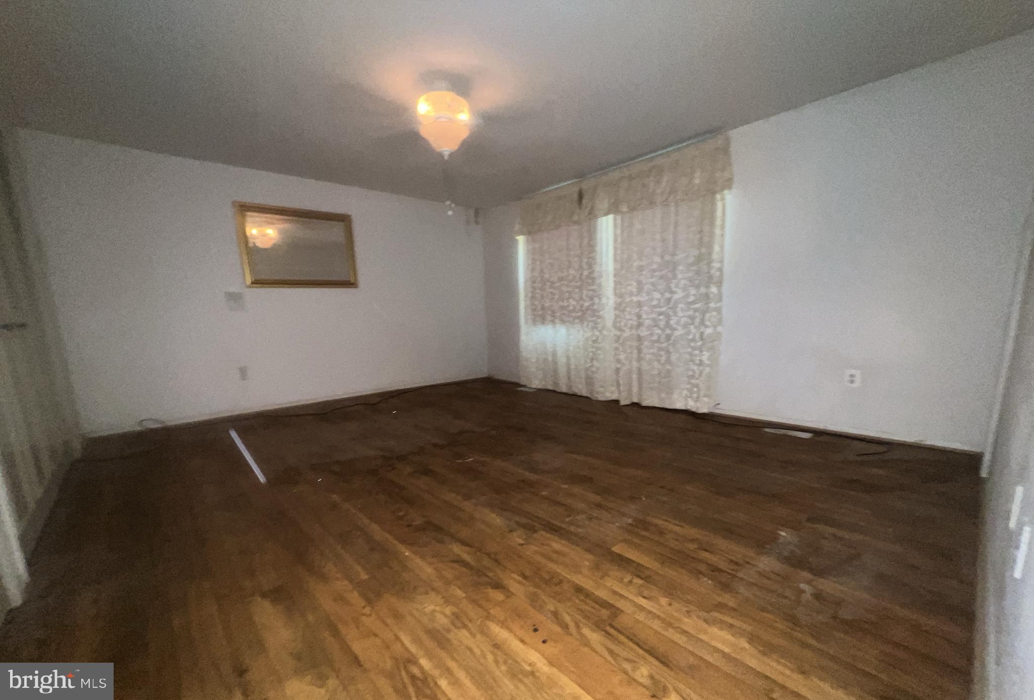 1723 Gabriel Court Crofton, MD 21114 - Photo 18 of 46 an empty room with wooden floor and windows