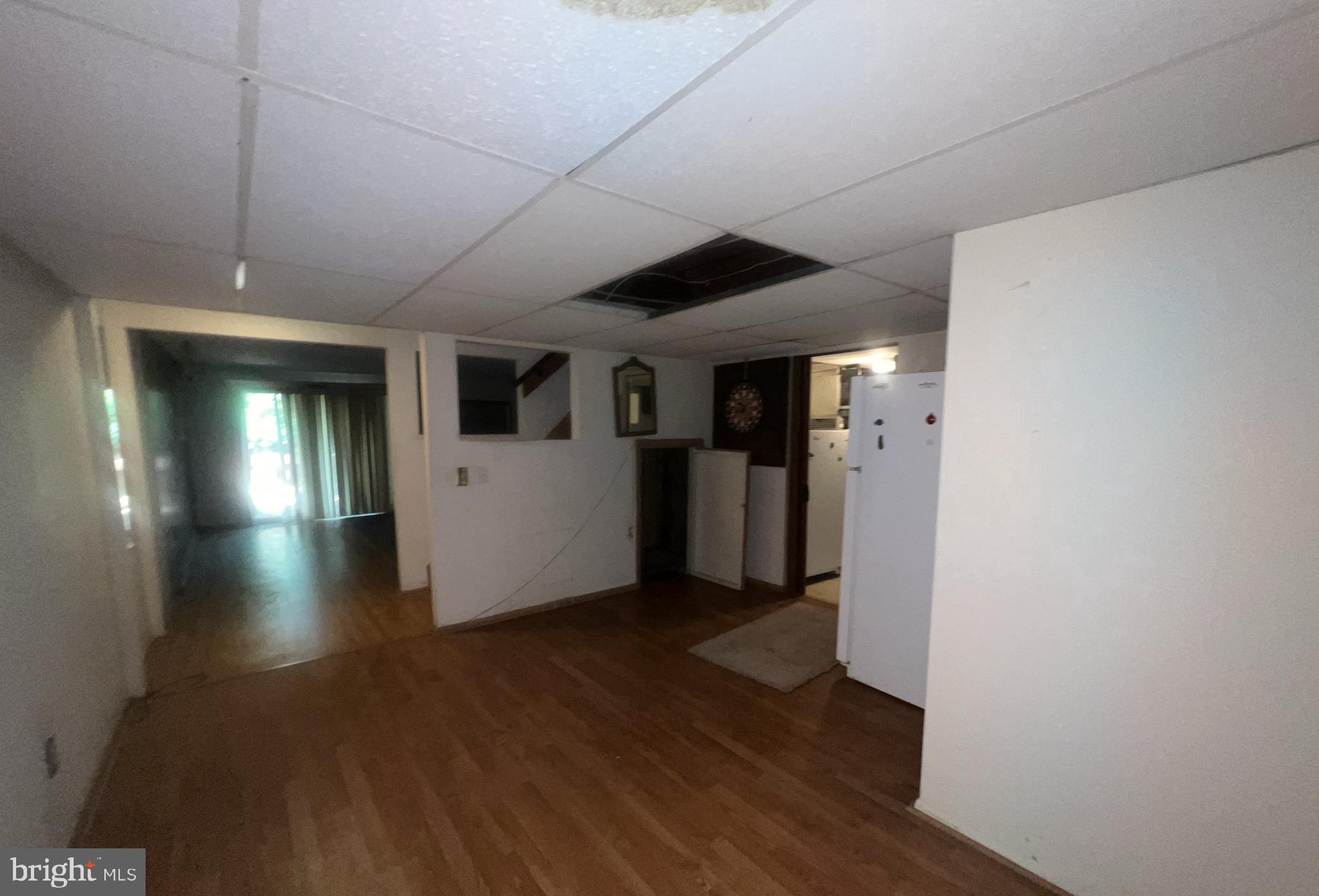 1723 Gabriel Court Crofton, MD 21114 - Photo 30 of 46 a view of a hallway with wooden floor and a living room