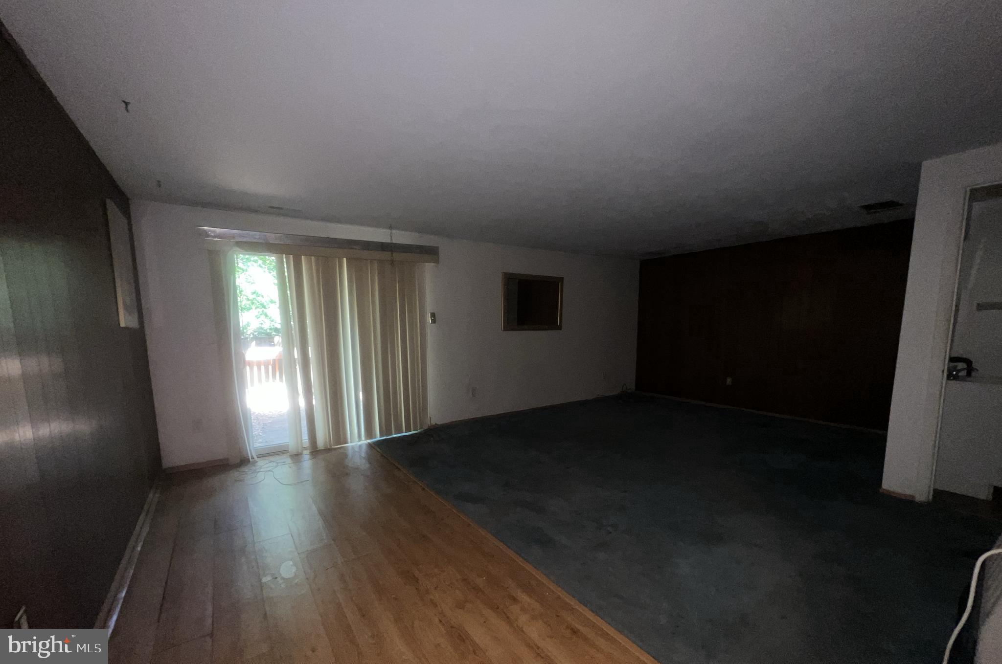 1723 Gabriel Court Crofton, MD 21114 - Photo 35 of 46 a view of an empty room with wooden floor and a window
