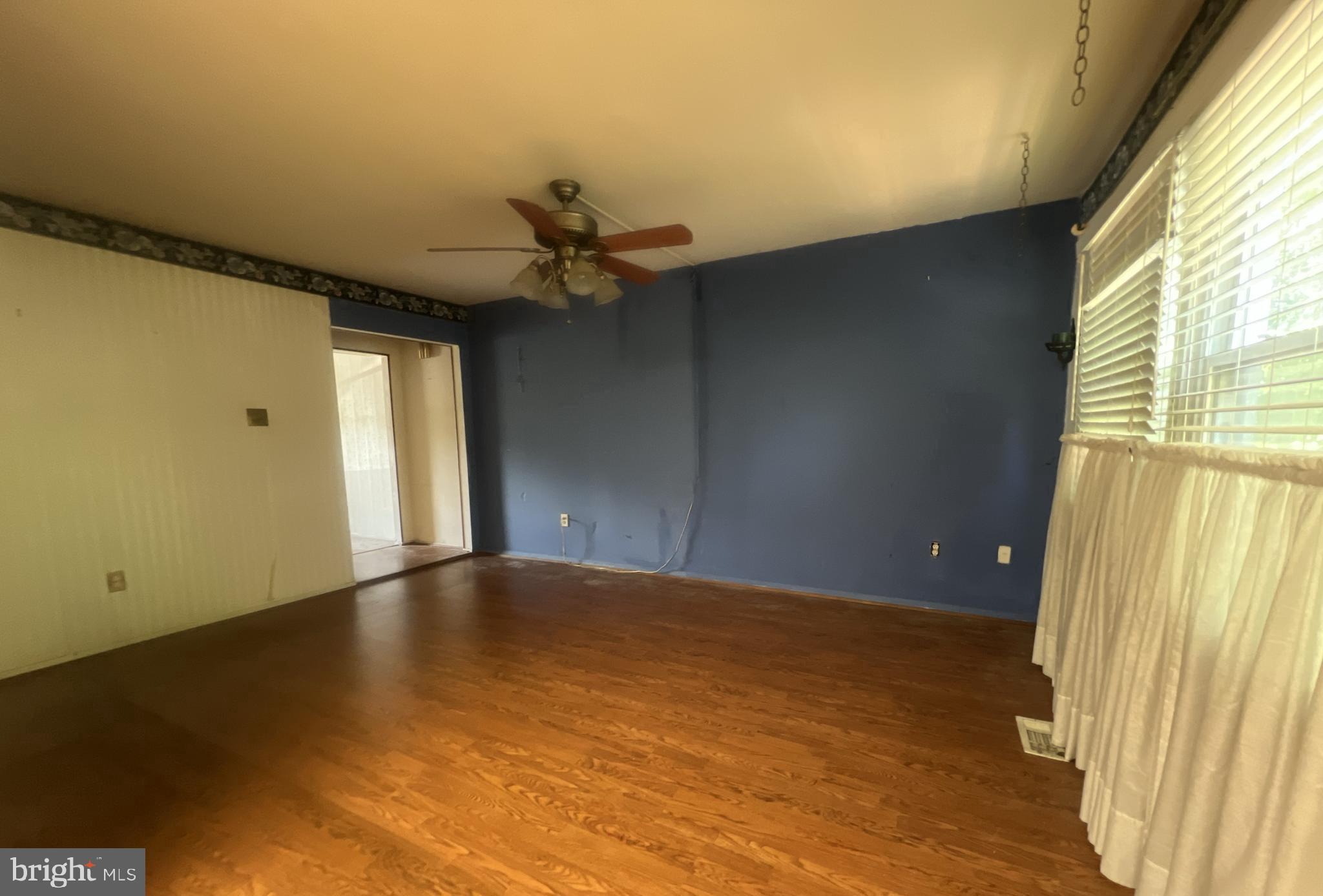 1723 Gabriel Court Crofton, MD 21114 - Photo 10 of 46 an empty room with wooden floor and windows