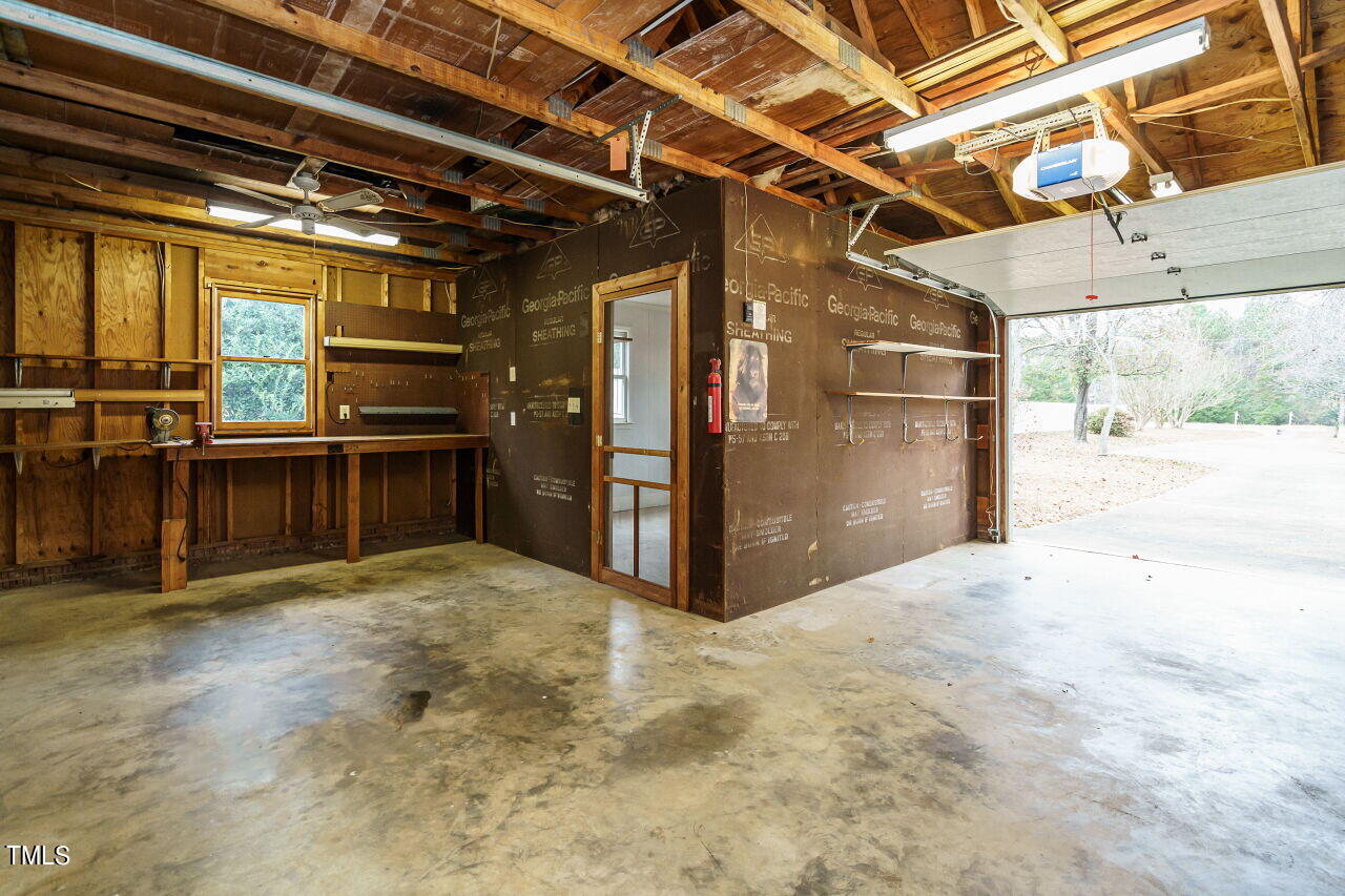 5917 Countryview Lane Raleigh, NC 27606 - Photo 25 of 43 Whether you have practical needs, artistic ambitions, or a combination of both, this detached garage/workshop is here to fulfill them. It's a space where your dreams can become a reality, and where your hobbies and passions can thrive.