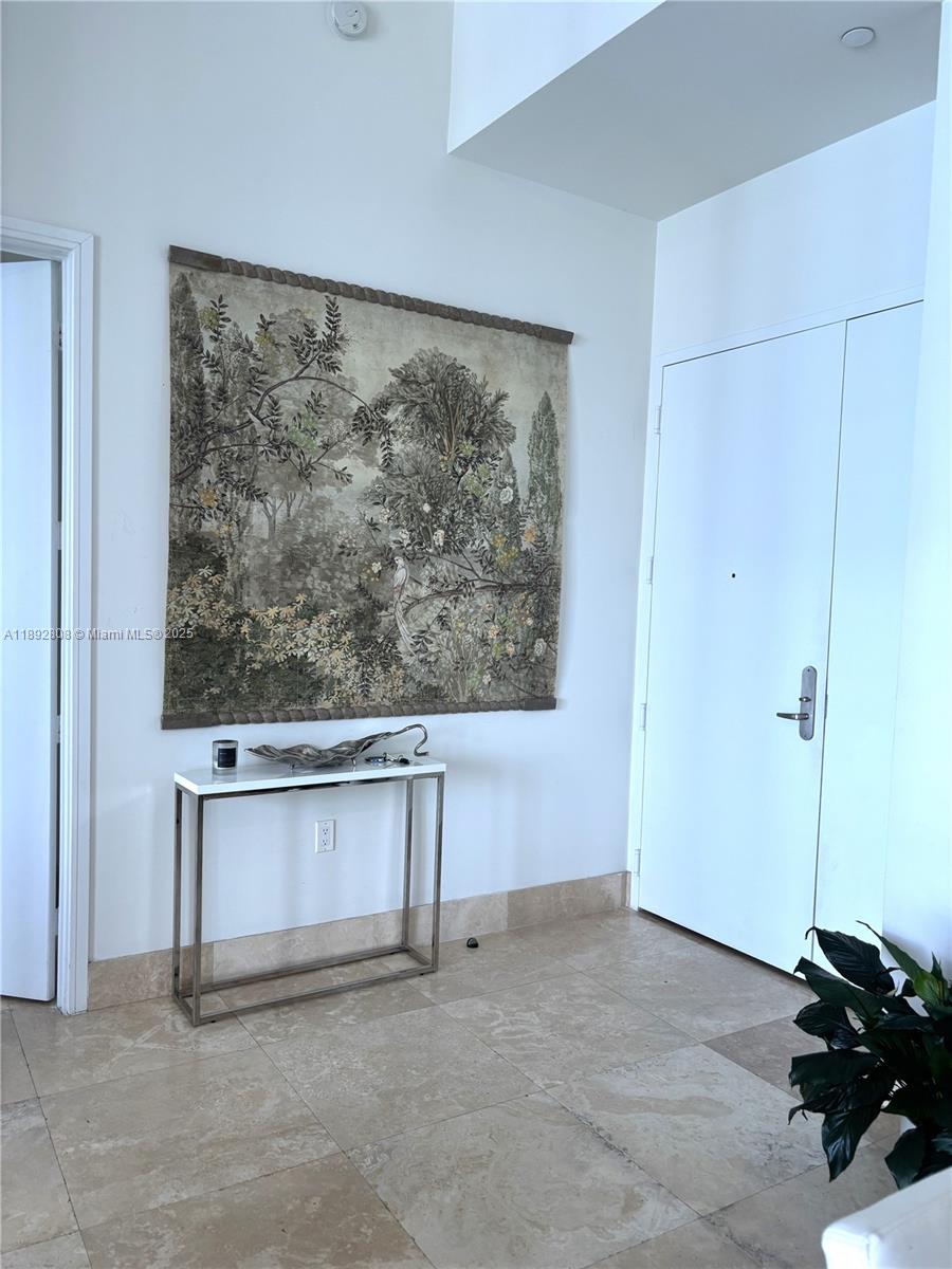 900 Brickell Key Boulevard, Unit 2602 Miami, FL 33131 - Photo 18 of 29 a view of room with a painting on the wall