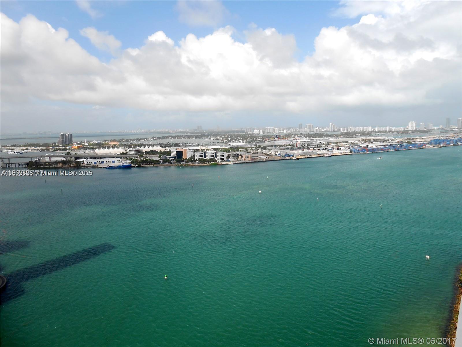 900 Brickell Key Boulevard, Unit 2602 Miami, FL 33131 - Photo 3 of 29 a view of a city with an ocean