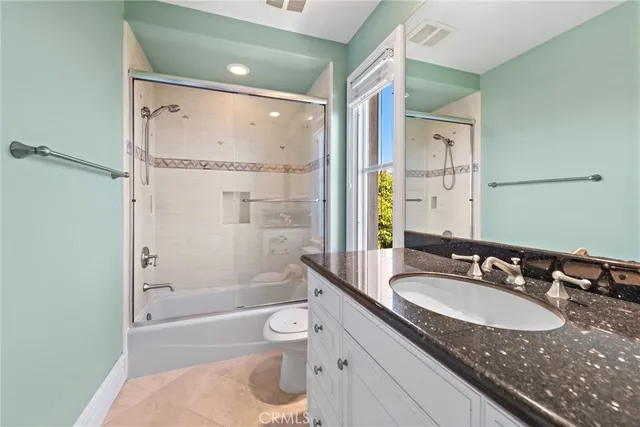 a view of a patio with a table and chairs